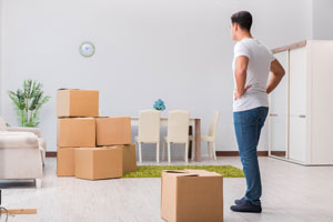 man frustrated by moving alone